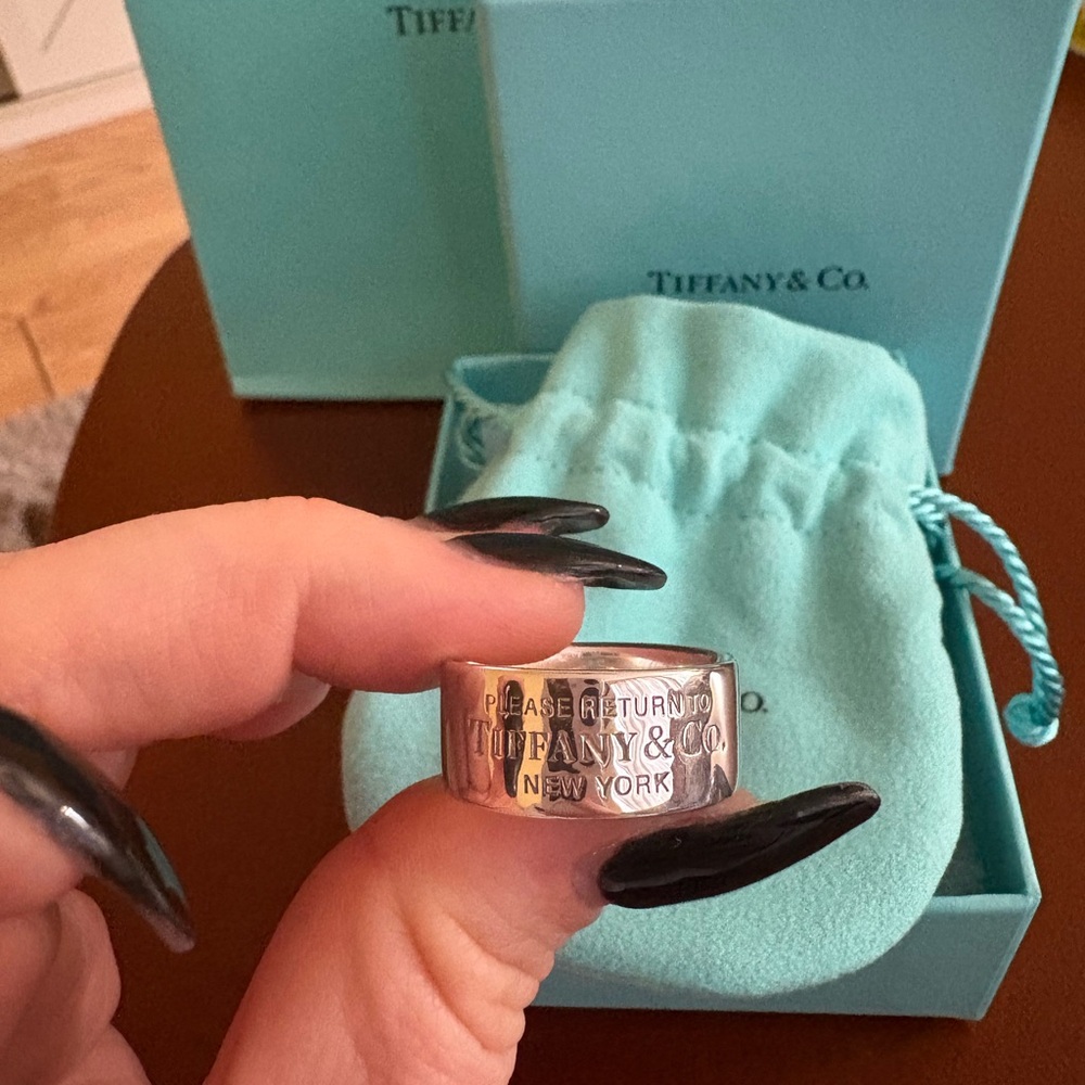 Tiffany & Co. return to Tiffany wide band. 10mm size 9.5
